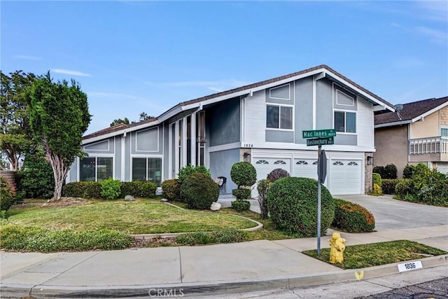 1836 Macinnes Pl, Placentia, CA 92870 - view of front of property with an attached garage, driveway, a front yard, and stucco siding