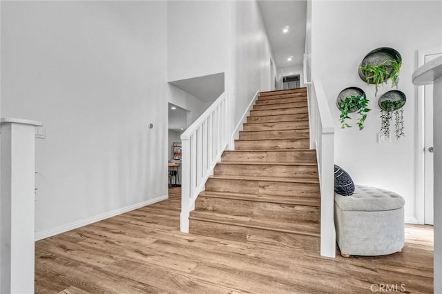 1836 Macinnes Pl, Placentia, CA 92870 - stairs featuring wood finished floors, recessed lighting, baseboards, and a high ceiling