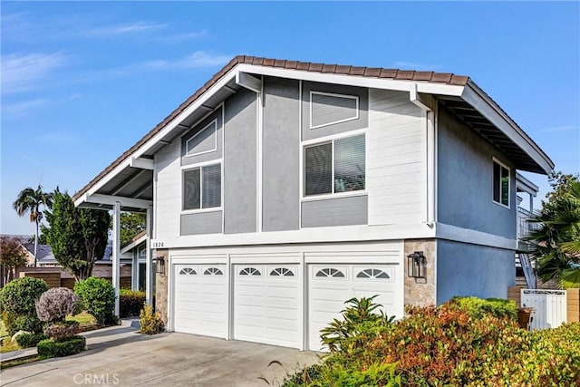 1836 Macinnes Pl, Placentia, CA 92870 - view of front of property with an attached garage, concrete driveway, and stucco siding