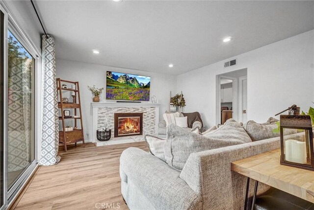 1836 Macinnes Pl, Placentia, CA 92870 - living area featuring light wood finished floors, a tiled fireplace, and recessed lighting