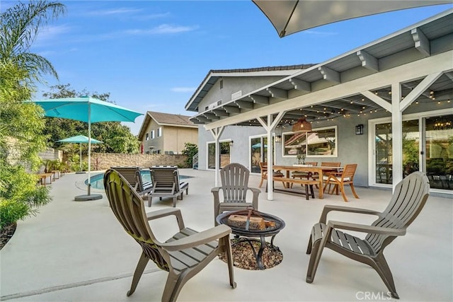 1836 Macinnes Pl, Placentia, CA 92870 - view of patio / terrace with a fire pit, outdoor dining space, and fence