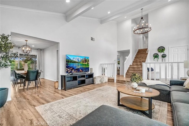 1836 Macinnes Pl, Placentia, CA 92870 - living room with a chandelier, stairs, wood finished floors, beam ceiling, and a towering ceiling