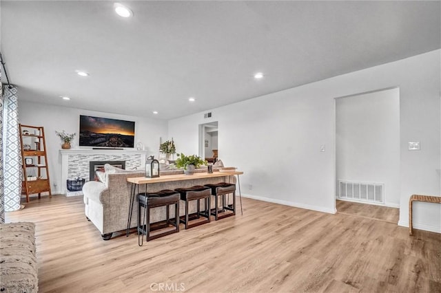 1836 Macinnes Pl, Placentia, CA 92870 - living room with light wood-type flooring, recessed lighting, a tile fireplace, and baseboards