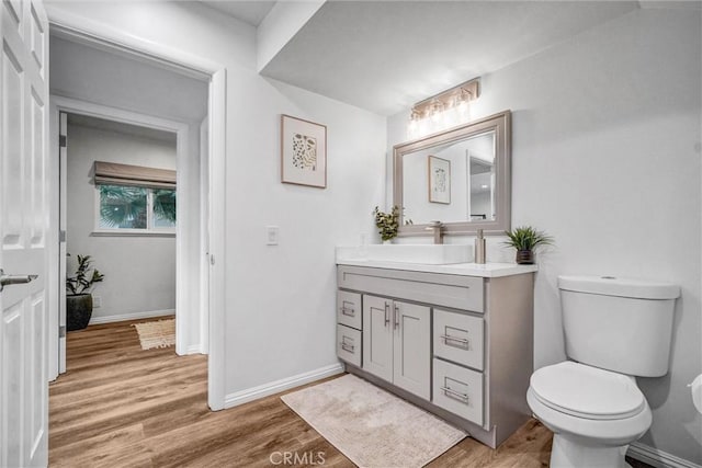 1836 Macinnes Pl, Placentia, CA 92870 - bathroom featuring wood finished floors, toilet, vanity, and baseboards