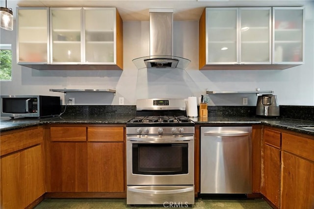 1274 Humboldt Ave, Chico, CA 95928 - kitchen featuring appliances with stainless steel finishes, island range hood, dark stone counters, and brown cabinets