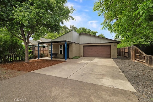 1274 Humboldt Ave, Chico, CA 95928 - view of front facade featuring driveway, a garage, and fence