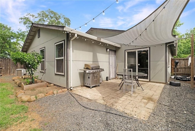 1274 Humboldt Ave, Chico, CA 95928 - back of house featuring fence, a patio area, stucco siding, and central air condition unit