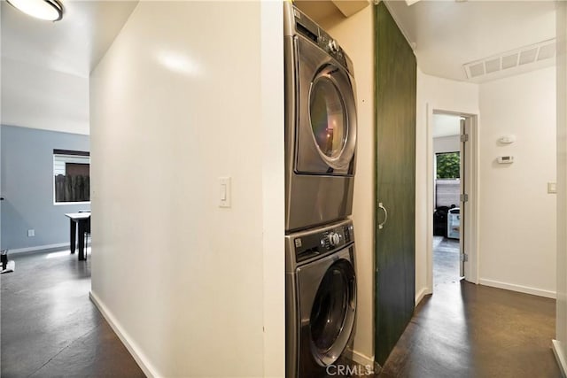 1274 Humboldt Ave, Chico, CA 95928 - clothes washing area featuring stacked washer and clothes dryer and baseboards