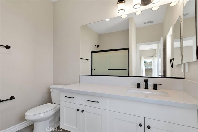 21192 Zuni Rd, Apple Valley, CA 92307 - full bath with vanity, toilet, a shower, and baseboards