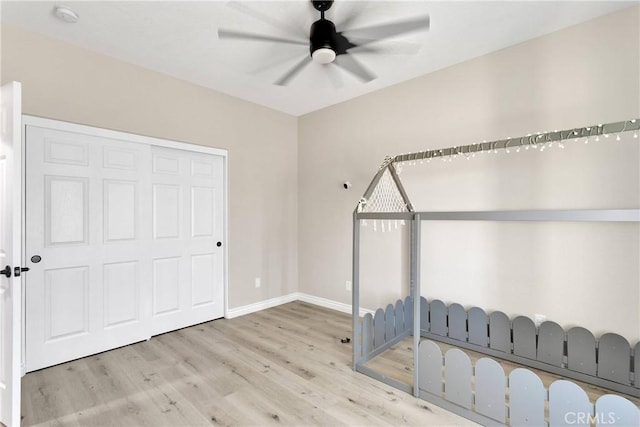 21192 Zuni Rd, Apple Valley, CA 92307 - unfurnished bedroom with wood finished floors, baseboards, and a ceiling fan