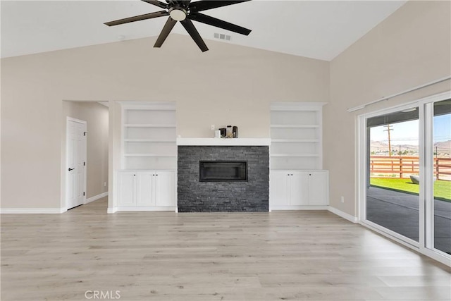 21192 Zuni Rd, Apple Valley, CA 92307 - unfurnished living room featuring a ceiling fan, high vaulted ceiling, baseboards, a fireplace, and light wood-type flooring