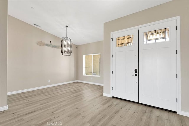 21192 Zuni Rd, Apple Valley, CA 92307 - entryway with a chandelier, light wood-type flooring, and baseboards