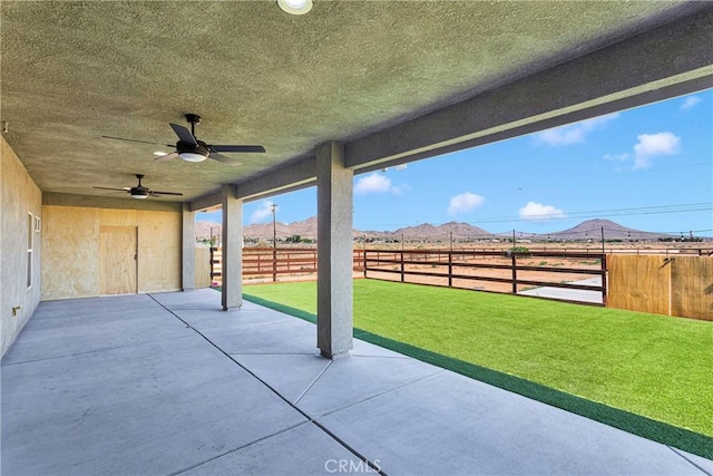 21192 Zuni Rd, Apple Valley, CA 92307 - view of patio with ceiling fan and a mountain view