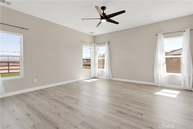 21192 Zuni Rd, Apple Valley, CA 92307 - empty room with light wood finished floors, healthy amount of natural light, ceiling fan, and baseboards