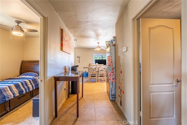 6916 36th St, Jurupa Valley, CA 92509 - hall with baseboards and light tile patterned flooring