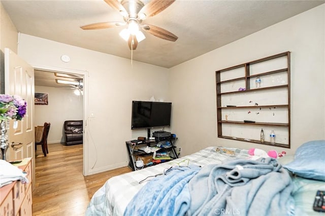 6916 36th St, Jurupa Valley, CA 92509 - bedroom with light wood finished floors, attic access, baseboards, and a ceiling fan