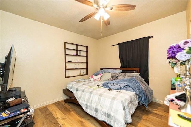 6916 36th St, Jurupa Valley, CA 92509 - bedroom with wood finished floors, baseboards, and ceiling fan