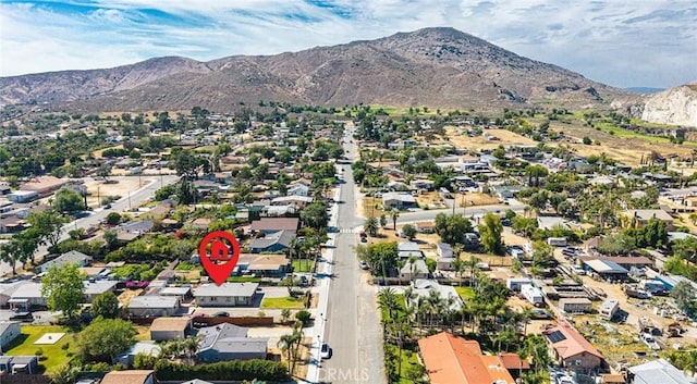 6916 36th St, Jurupa Valley, CA 92509 - aerial view of property and surrounding area with a mountainous background and nearby suburban area