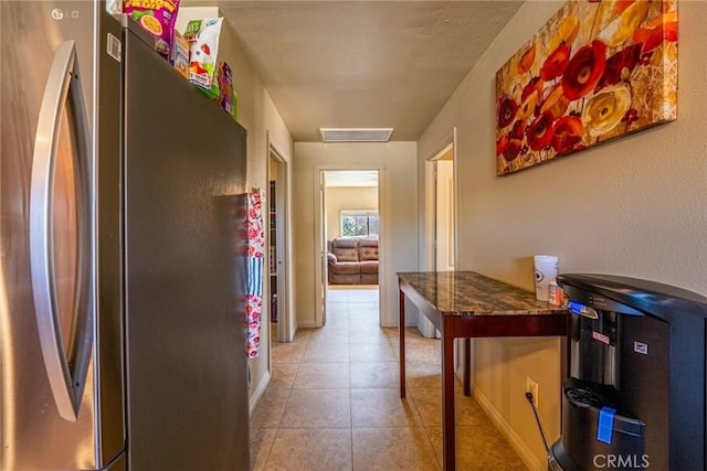 6916 36th St, Jurupa Valley, CA 92509 - hall featuring light tile patterned floors and baseboards