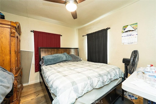 6916 36th St, Jurupa Valley, CA 92509 - bedroom with wood finished floors, ceiling fan, and baseboards