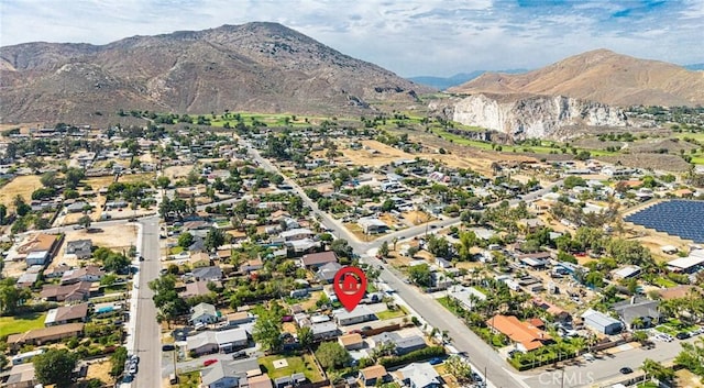6916 36th St, Jurupa Valley, CA 92509 - aerial view of property's location with a mountainous background and nearby suburban area