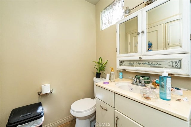 6916 36th St, Jurupa Valley, CA 92509 - bathroom with toilet, vanity, and baseboards