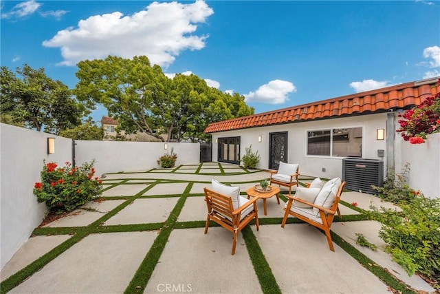 80 Seton Rd, Irvine, CA 92612 - fenced backyard featuring cooling unit, a patio, and an outdoor hangout area