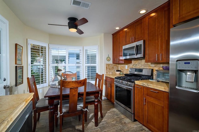 4547 Cordoba Way, Oceanside, CA 92056 - kitchen featuring appliances with stainless steel finishes, ceiling fan, backsplash, dark wood finished floors, and recessed lighting