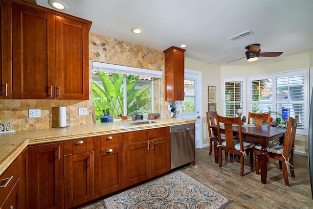 4547 Cordoba Way, Oceanside, CA 92056 - kitchen featuring a sink, dishwasher, light countertops, ceiling fan, and dark wood-type flooring