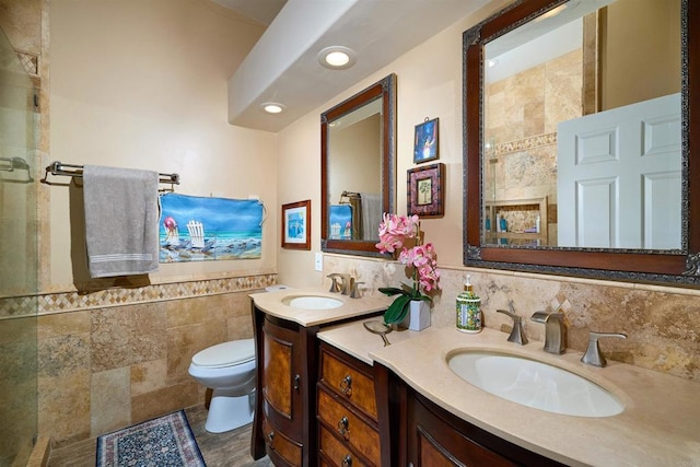 4547 Cordoba Way, Oceanside, CA 92056 - bathroom with vanity, toilet, an enclosed shower, wainscoting, and tile walls