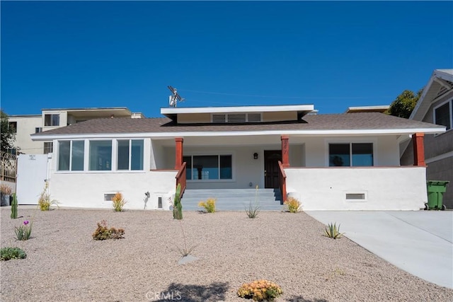 247 S Benton Way, Los Angeles, CA 90057 - view of front facade with stucco siding, covered porch, and a shingled roof
