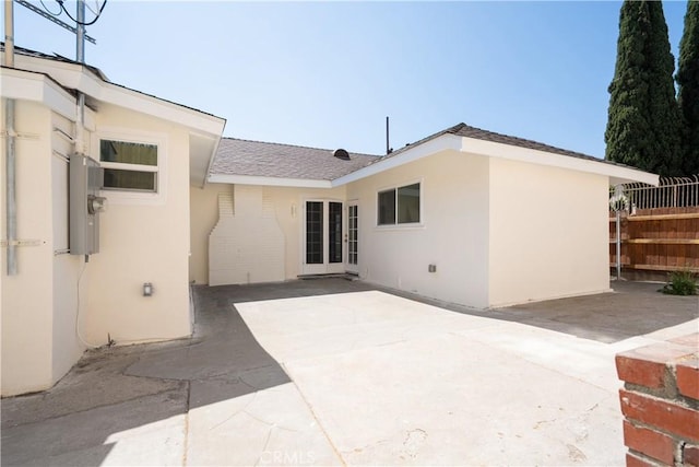 247 S Benton Way, Los Angeles, CA 90057 - rear view of house with a patio area, stucco siding, and roof with shingles