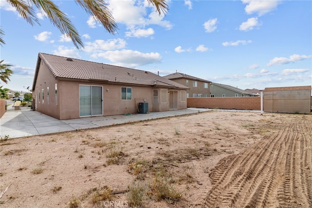 9011 Honeysuckle Ave, Hesperia, CA 92344 - back of property featuring a patio area, a tile roof, stucco siding, and a fenced backyard