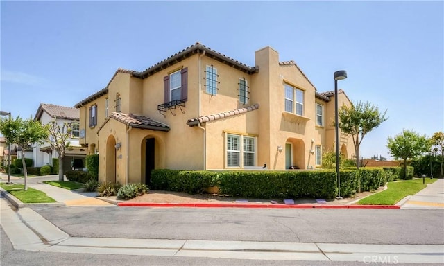 2750E Oak Hill Dr Unit 16, Ontario, CA 91761 - view of front facade featuring stucco siding and a tile roof