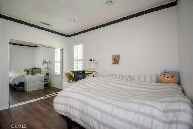 2750E Oak Hill Dr Unit 16, Ontario, CA 91761 - bedroom featuring ornamental molding, dark wood-style floors, a closet, and recessed lighting