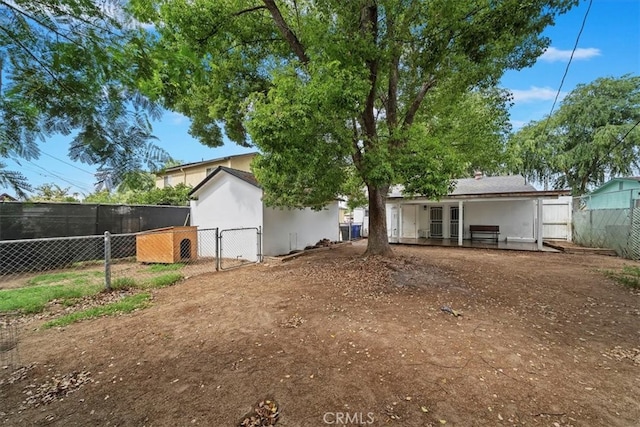 2329 Roxbury Dr, San Bernardino, CA 92404 - back of house with fence and a gate