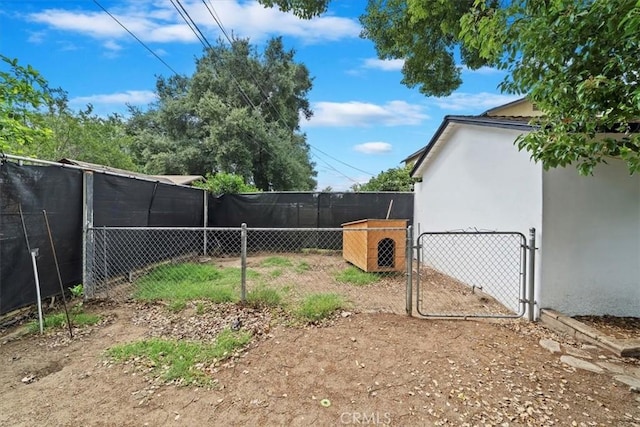2329 Roxbury Dr, San Bernardino, CA 92404 - view of yard featuring a gate and fence