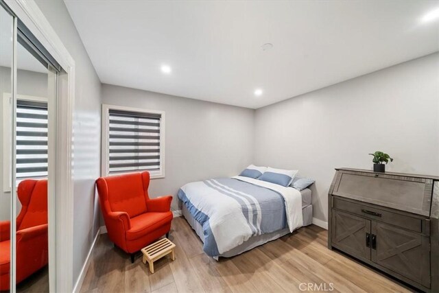 2329 Roxbury Dr, San Bernardino, CA 92404 - bedroom with light wood-type flooring, recessed lighting, and baseboards