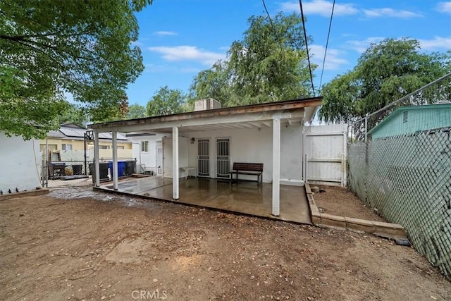 2329 Roxbury Dr, San Bernardino, CA 92404 - back of property featuring a patio area, a gate, a fenced backyard, and stucco siding