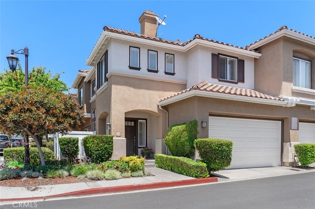 170 Valley View Ter, Mission Viejo, CA 92692 - view of front of house with a chimney, stucco siding, a tile roof, and an attached garage