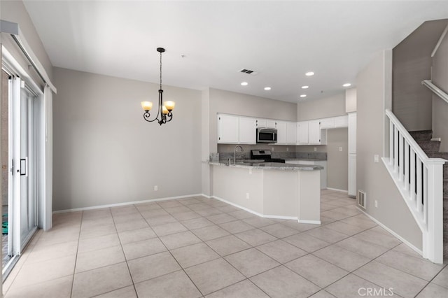 170 Valley View Ter, Mission Viejo, CA 92692 - kitchen featuring stainless steel appliances, a peninsula, light tile patterned flooring, white cabinets, and a chandelier