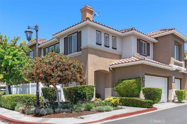 170 Valley View Ter, Mission Viejo, CA 92692 - view of front facade featuring a tiled roof, a garage, stucco siding, and a chimney