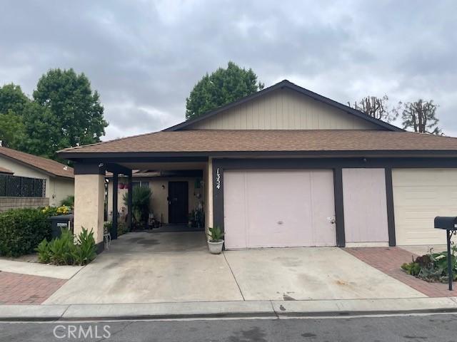 1354 Bushy Tail Trl, San Jacinto, CA 92583 - single story home with concrete driveway, roof with shingles, and an attached garage