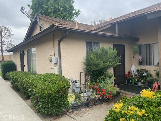 1354 Bushy Tail Trl, San Jacinto, CA 92583 - view of side of property featuring stucco siding