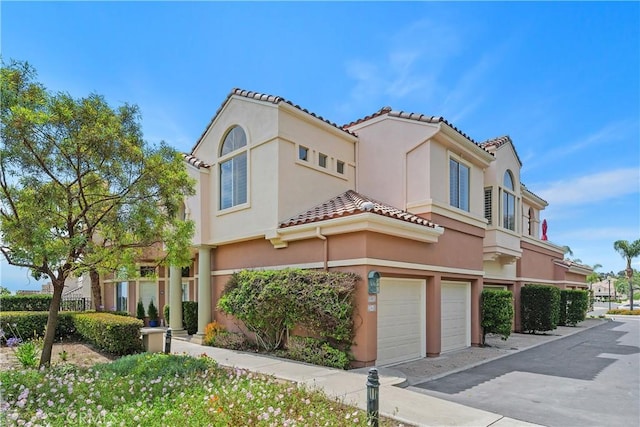 123 Costa Brava, Laguna Niguel, CA 92677 - mediterranean / spanish-style home featuring an attached garage, stucco siding, and a tiled roof