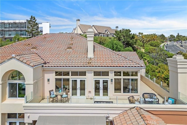 123 Costa Brava, Laguna Niguel, CA 92677 - rear view of property with french doors, stucco siding, a tile roof, and a chimney