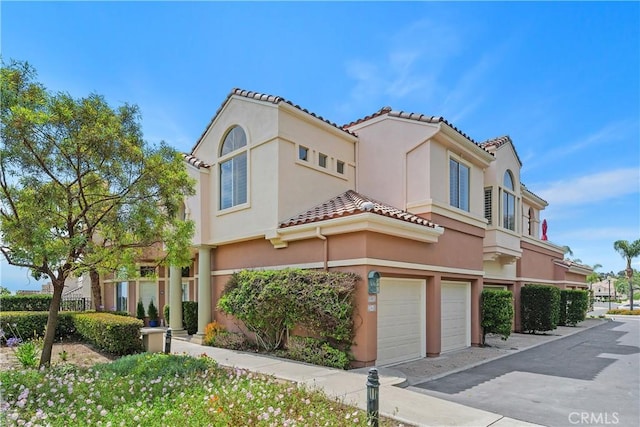 123 Costa Brava, Laguna Niguel, CA 92677 - mediterranean / spanish home with an attached garage, stucco siding, and a tile roof
