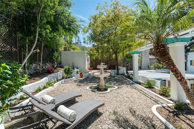 view of yard featuring fence and a patio area