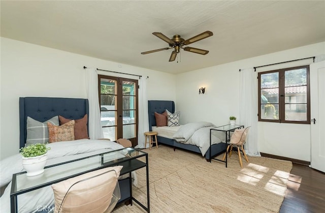 bedroom with wood finished floors and a ceiling fan