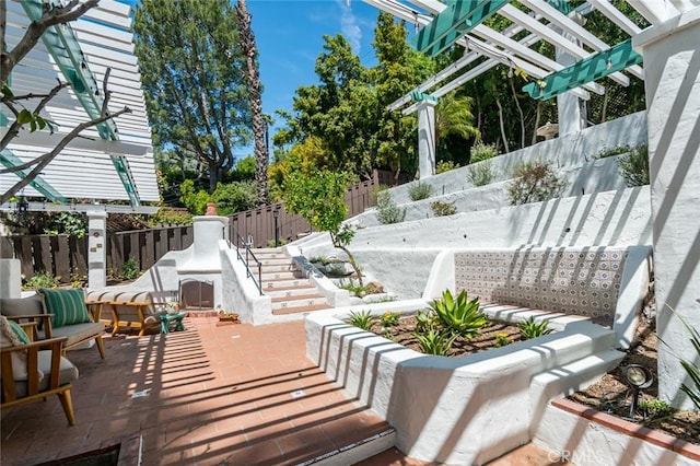 view of patio / terrace with a pergola and a fenced backyard